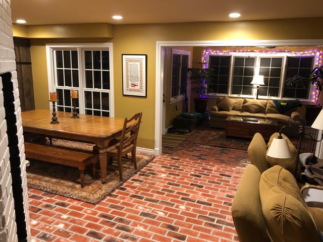 Brick floor in a dining area.  Patriot Pavers by PortStone Boston Harbor brick color.  Used Red Alpha Brick color.