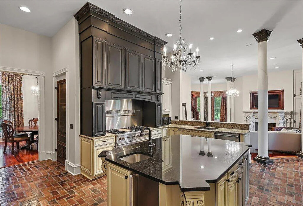 Large kitchen with a Herringbone brick floor.  Charleston brick color by PortStone.